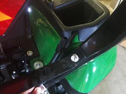 with zip tie to the tractor harness (L).
