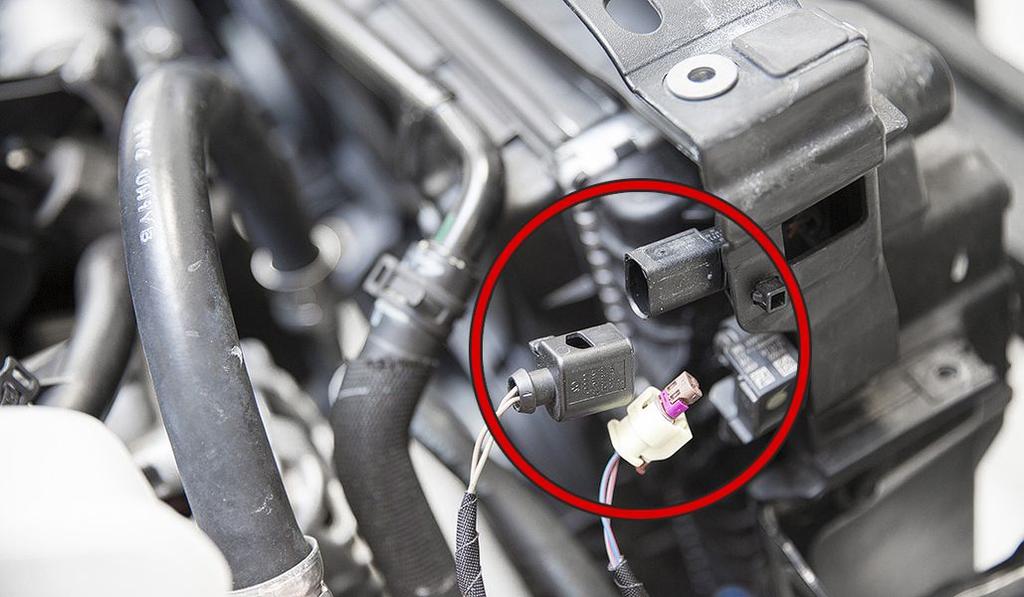Remove the three connectors from the radiator support. There are two yellow connectors and one black connector located at the top of the radiator support.