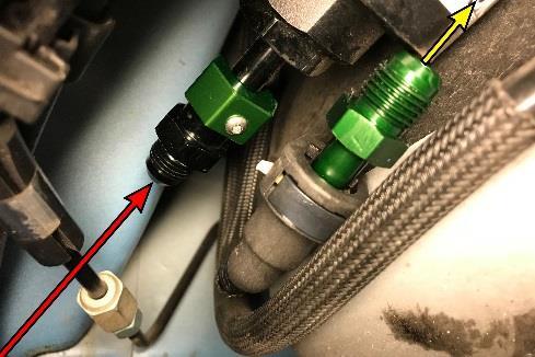 There are 3 SAE quick connect fittings in this area. Only the pre filter fitting will be unplugged. It is located furthest to the RH side of the car and has a black thumb tab (shown).
