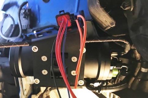 For strain relief, allow slack in the wire so it does not pull away from the OEM fuel pump controller. Use the included split wire loom to protect the wire.