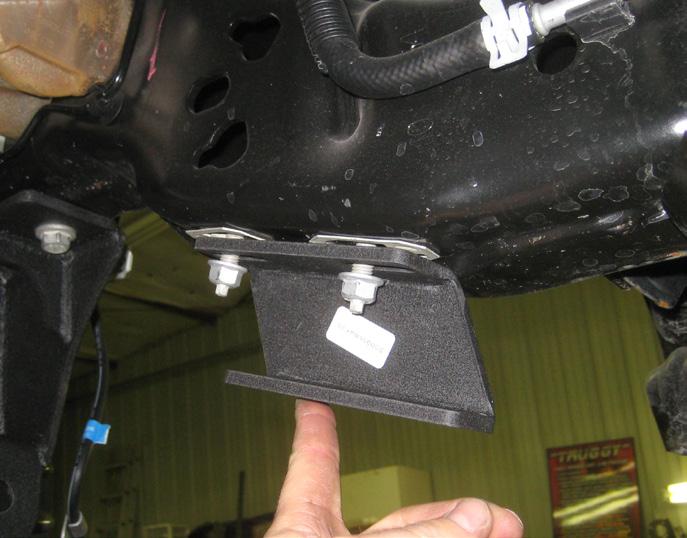 Locate the driver side sway bar drop bracket, also (2) the brackets to the OE threaded holes on the frame using 7/16 x 1 1/2 bolts, (4) 3/8 washers, and (2) 7/16 unitorque nuts from