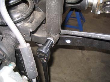 Install the new longer Daystar shocks at the top first and jack up the axle to connect the lower mounting.