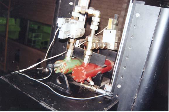 CHAPTER 4: EXPERIMENTAL WORK 4-4 Figure 4-3: Accumulators, damper and valves secured on top of sprung mass 4.2.