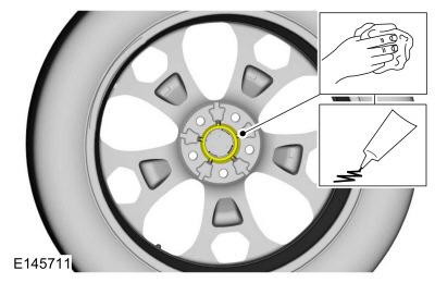 Install wheel and tire WARNING: When a wheel is installed, always remove any corrosion, dirt or foreign material present on the mounting surface of the wheel and the mounting surface of the wheel