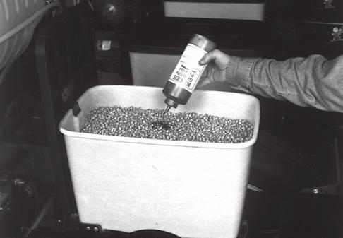 ROW UNIT OPERATION 82354-1 SEED HOPPER 60620-69 One tablespoon of powdered graphite per hopper fill of seed should be mixed in with the seed each time the hopper is filled.