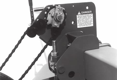 MAINTENANCE CHAIN TENSION ADJUSTMENT 53051-17 The drive chains have a spring loaded idler and