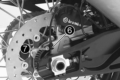 Guideline In order for the rear wheel to be correctly aligned, the markings on the left and right chain adjusters must be in the same position relative to the reference marks. Tighten nut.