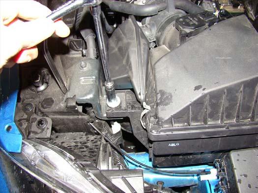 1. Working in the engine bay, start removal of the stock air box by