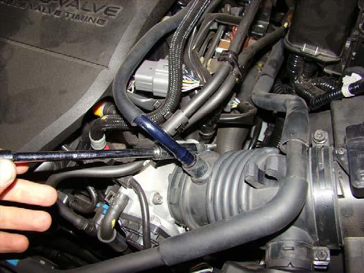 Loosen the bolt holding the intake