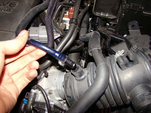 7. Pull on the hose on the top of the intake to remove it as pictured. 8.