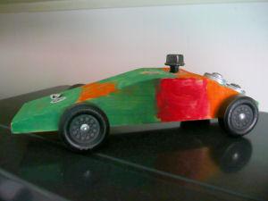 6) Paint car as desired. Typically any kind of paint is decent I ve found. One year my son used poster paint for the true kid effect: Another year we used acrylic paint which worked well.