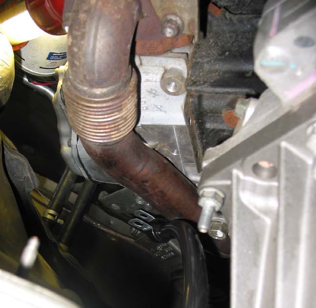 18 Re-install the MAP sensor and install the newly supplied coolant hose from the brass check valve to the return line.