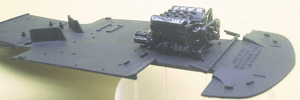 (Fig. #4) I then mounted the completed base engine onto the chassis pan, which I painted flat black. (Fig.