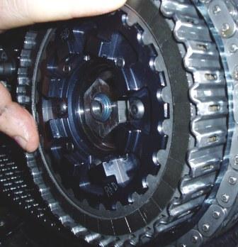 22. Install the measured clutch pack, 10 friction disks and 9 steel plates, over the center clutch and into the basket. Make sure the first disk installed is a friction disk. 23.