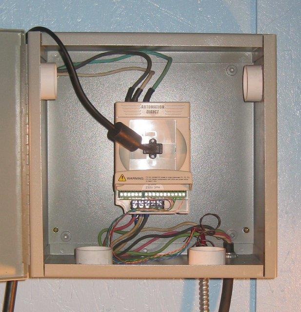 The input power wires with crimped on connectors The VFD unit mounted in the cabinet. Note the four vents.