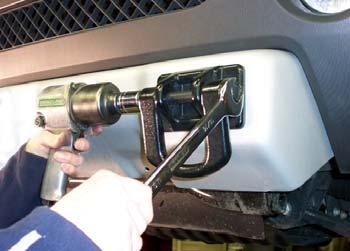 On each side, remove one 10mm (head) bolt attaching the bumper support to the