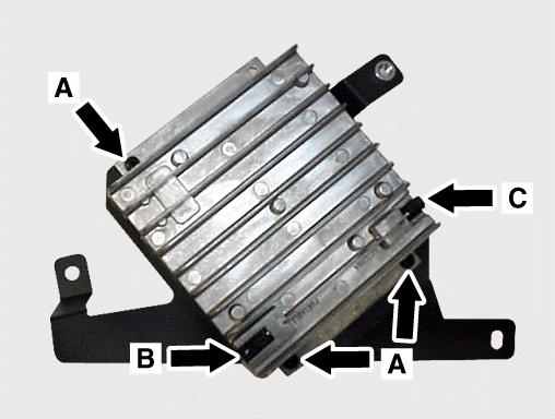 Mount the voice control module (VCM) in the place of the removed AKG unit by inserting the VCM tab into the clip (C, Figure 6) and using the previously removed Phillips screw to secure it (B, Figure