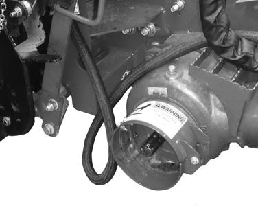 ATTACHING HEADER TO COMBINE 10. Pull back collar (A) on end of driveline and push onto combine output shaft (B) until collar locks. 11. Open cover (A) on header receptacle. 12.