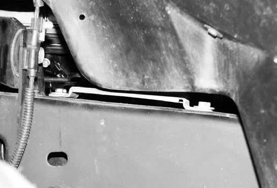 behind the upper control arm) to the top of the driver s side frame rail Figure