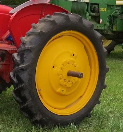 Lindsay wanted to share one of his prize restorations and had his wife Chris take a picture of him with his, what appears to be a John Deere 820.