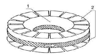rotates with a constant velocity between the two coplanar concentric arrays of stator electrodes.