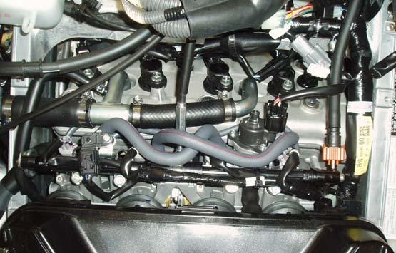 The ignition must be turned OFF before installation. Figure A 1 Lift the front hood up. 2 Remove the left hand side cover.