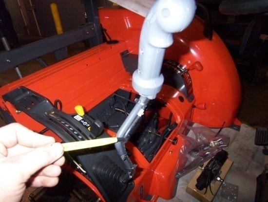 11) Remove the stock handle from the loader control lever. Next remove the bushing from the new handle and drill it to fit the control lever.