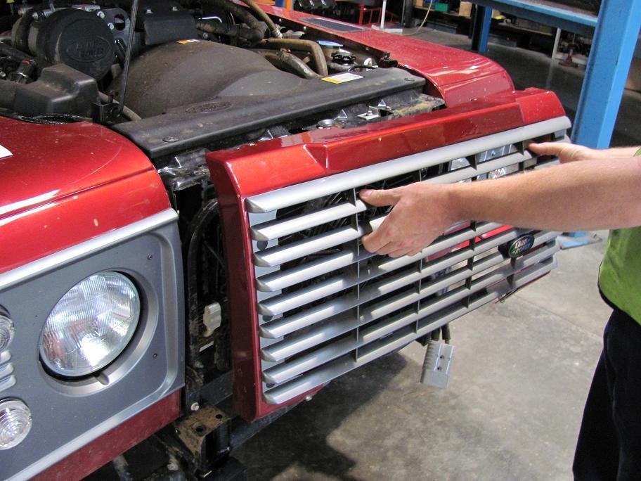 1. Open the bonnet and remove the grille from the vehicle by removing the 4 screws
