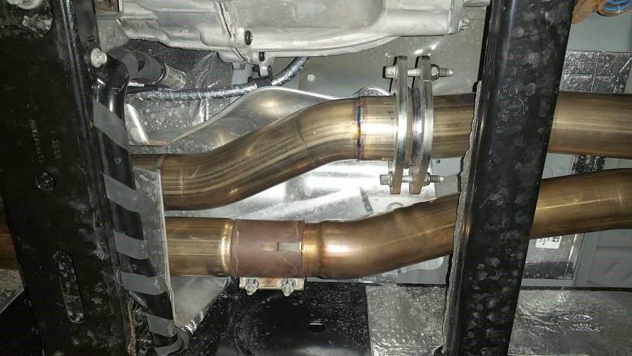 Install the lower right heat shield to the frame before installing the right-side downpipe, (1) bolt (10mm socket). You will not be able to install the heat shield after the downpipe is in. 21.