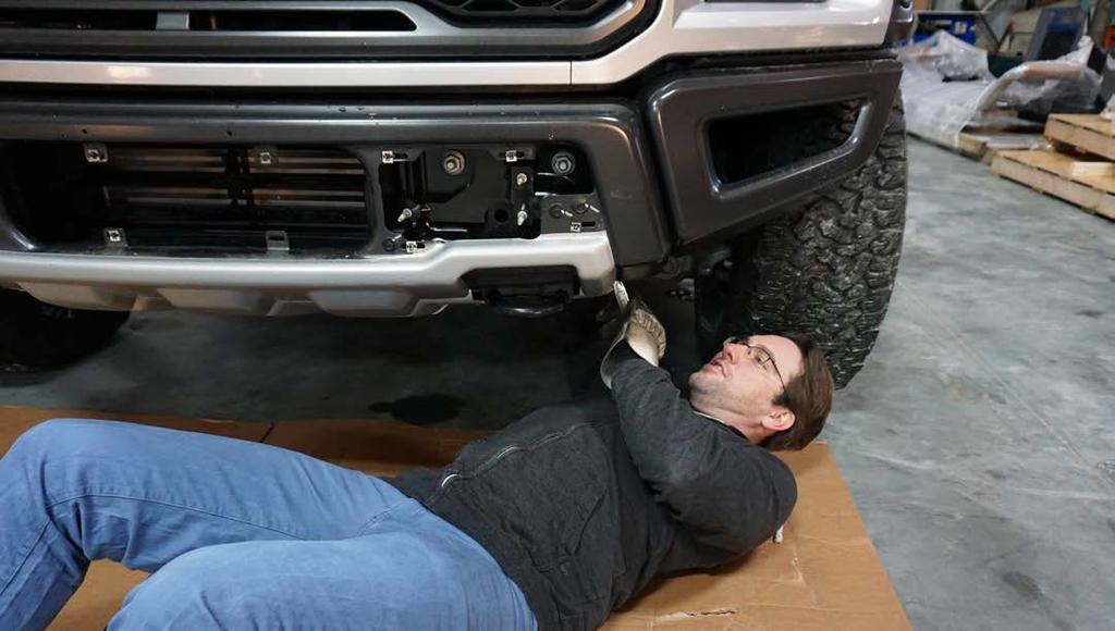 Lay under the truck.