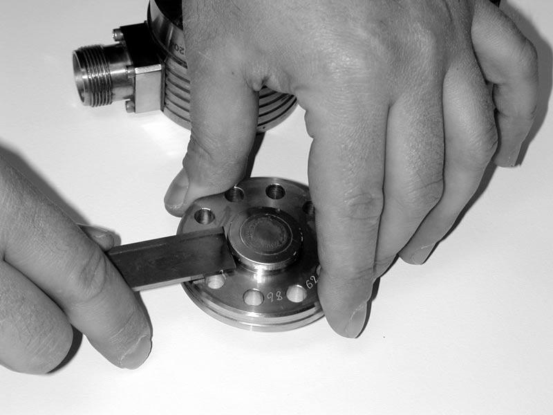 Figure 4: Transducer base, cap and tools. 4. Remove the diaphragm from the cap.