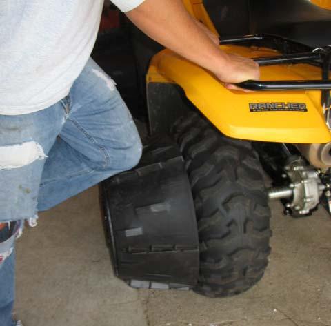 It is important to check the tightness of these nuts and the tap bolts each time before operating the vehicle.
