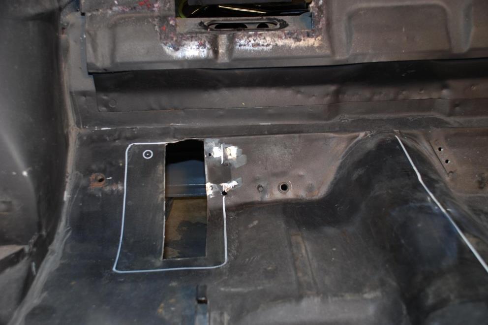 Check the holes from the bottom of the vehicle to insure you do not cut into the framerail. However, a small portion of the frame rail flange may need to be removed. g.