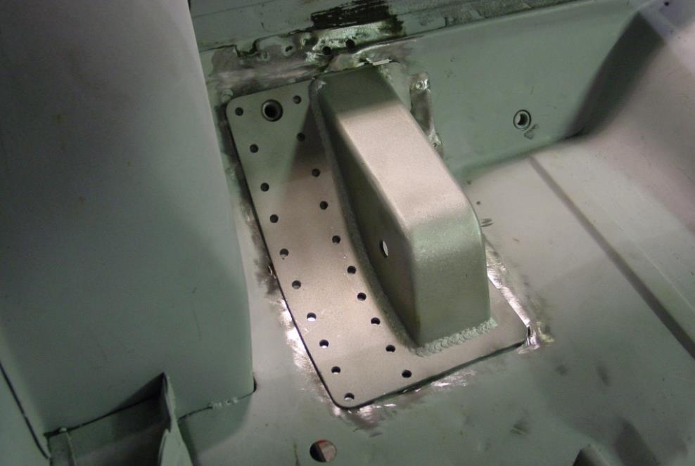 under the floor as shown in Figure 11. This will allow the pockets to be plug welded to the top of the frame rail. Figure 11 k. Make sure the pocket s centerline distance is 14 ¾.