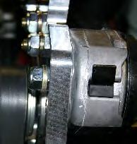Install the tensioner with the M10x90 hex head bolt. The pin on the back of the tensioner should fit into the hole in the plate.