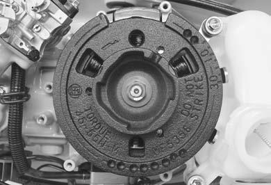 Installing Flywheel Components IMPORTANT: Flywheel, P/N 5076, is specially machined on inside rim to function properly with lighting coil. DO NOT use original flywheel.