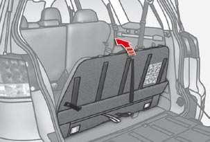 Unlock the head restraints by sliding the controls C and fold them onto the seat back. 4.