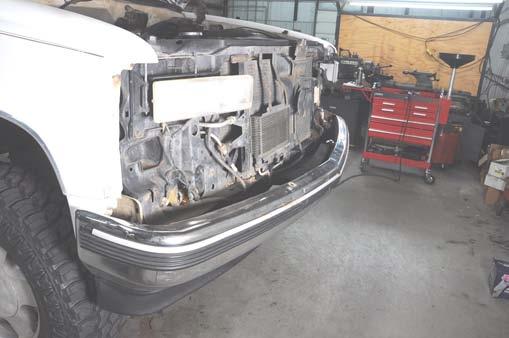 See Photo 56. 56. Install the supplied 7/16 x 1.5 bolts and washers.