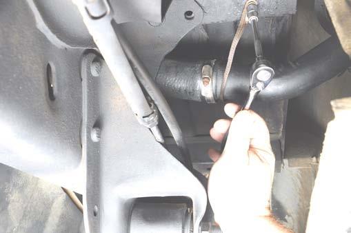 2. Using an 8mm socket, remove the hose clamps from the fuel filler neck and