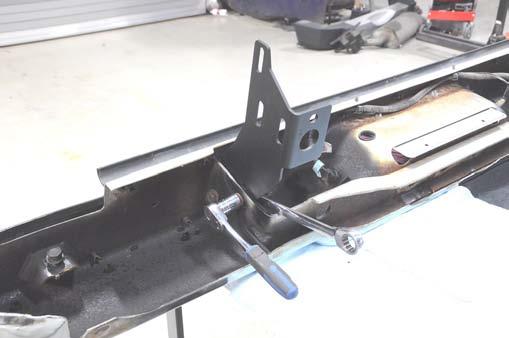 Install the supplied center bumper brackets on the bumper using the factory