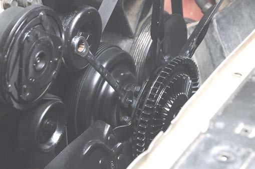 Using a 13mm wrench, remove the clutch fan from the water pump. See Photo 20.