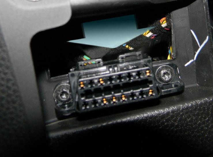 Gently Feed the OBDII connector cable up through the dash