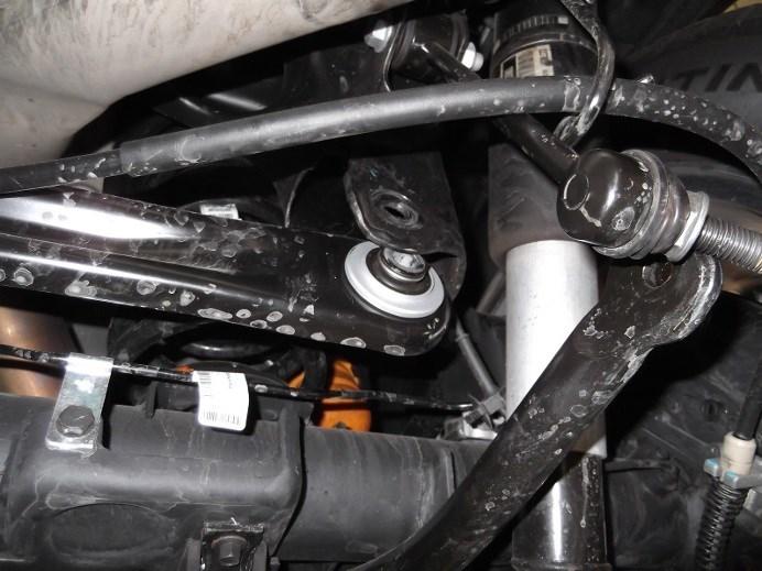 Unbolt the sway bar for more clearance and place the hardware aside for reinstallation later. (See Fig. 2) 3.