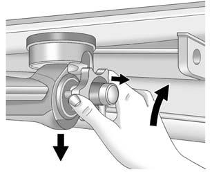 Pull the knob out and turn it clockwise as far as it will go. 2. Pull the hitch downwards out of the coupling housing and store it in a safe place. 3. Insert the plug in the housing.