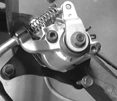 Install the brake caliper mounting bolts to the specified torque. Torque: 2.