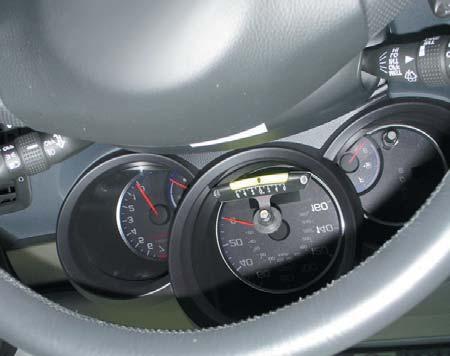 There are two ways to calibrate the gauge: Park the vehicle on a level surface, such as an alignment rack, and calibrate the gauge by moving the gauge until the ball is on the zero mark.