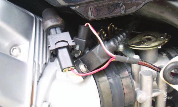 B 4 Unplug the stock wiring harness from the LH injector (Fig. B). FIG.