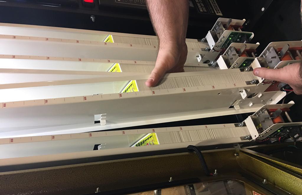 Replacing A Column 1. Turn off power to the dispenser. 2. Unplug the ribbon cable on the motor control board. 3. Lift the sheet metal latch under the front of the column to release the column. 4.