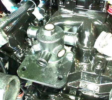 29. Install the thermostat-housing gasket (Item 6). Use RTV silicone sealer of both sides of the gasket. (The thermostat will no longer be located in the intake manifold.