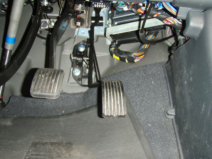 The 16 pin OBD II connector is attached to the lower dash,